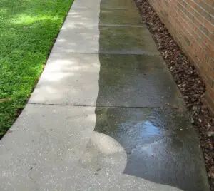 Before and after results of Prep Pros concrete cleaning service, clearly showing dirt and grime removed from a residential sidewalk surface.